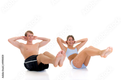 Young couple, female, male doing fitness exercises