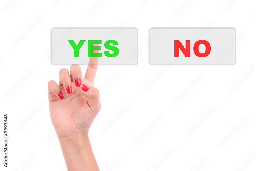 Woman's Finger pressing the Yes key - Isolated over white Woman's Finger pressing the Yes key - Isolated over white
