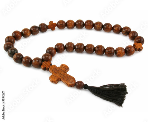 Wood rosary isolated on a white background photo