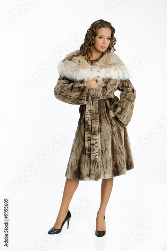 Young attractive woman in fur coat
