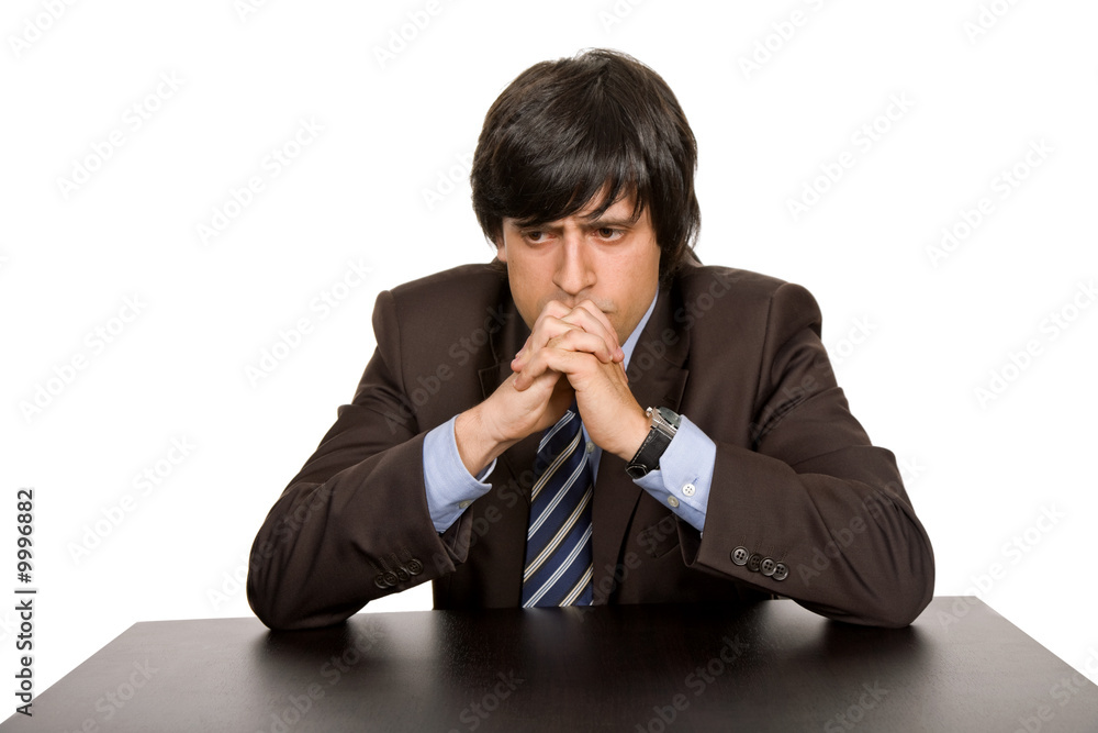 young business man on a desk, isolated on white