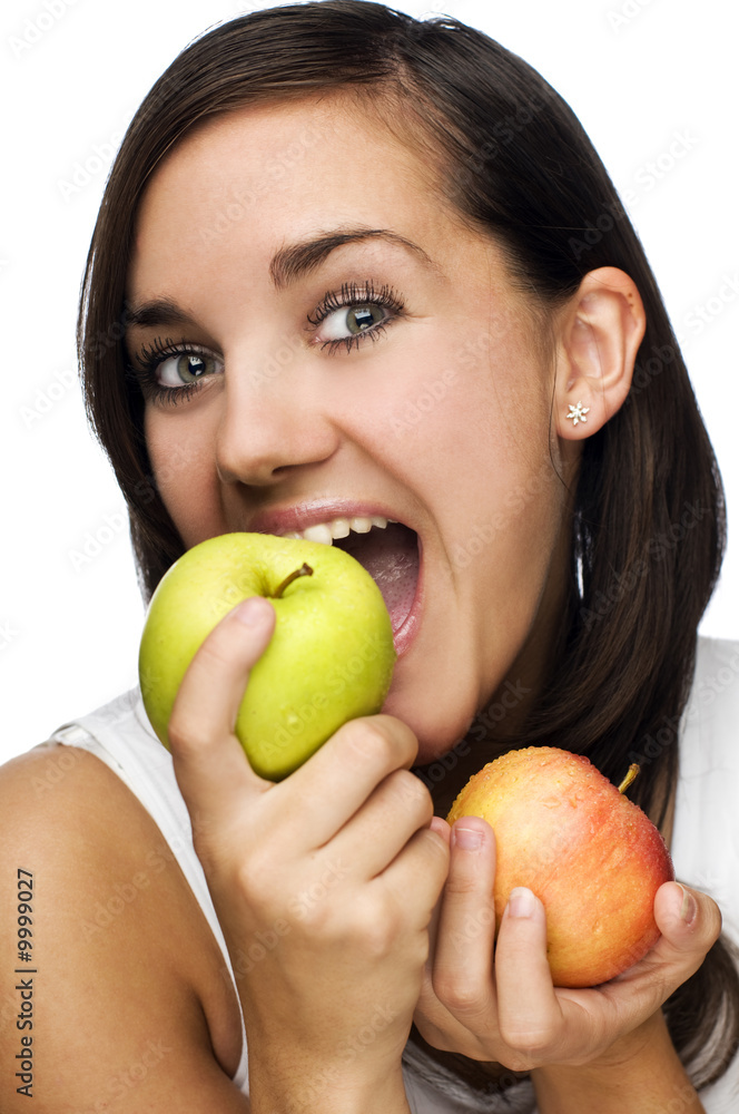 young brunette eating apple close up shoot