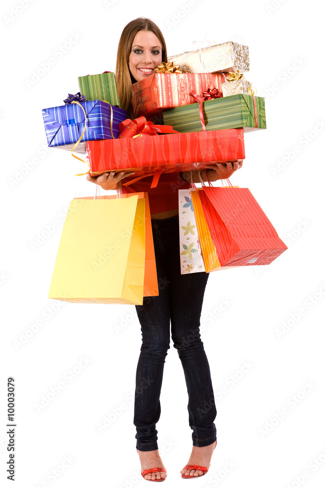 Attractive woman holding many gift boxes and bags