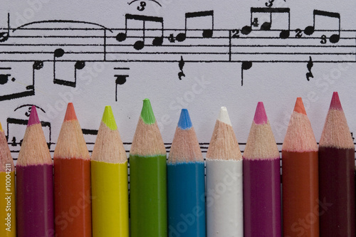 color pencils on music score