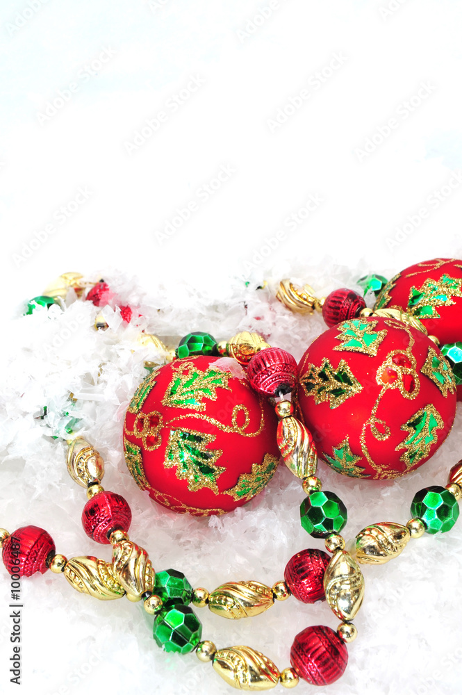 Christmas tree decorations on a white snowy background