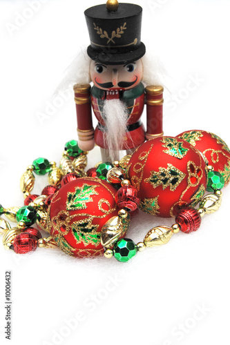 Red  green and gold Christmas decorations on a light background
