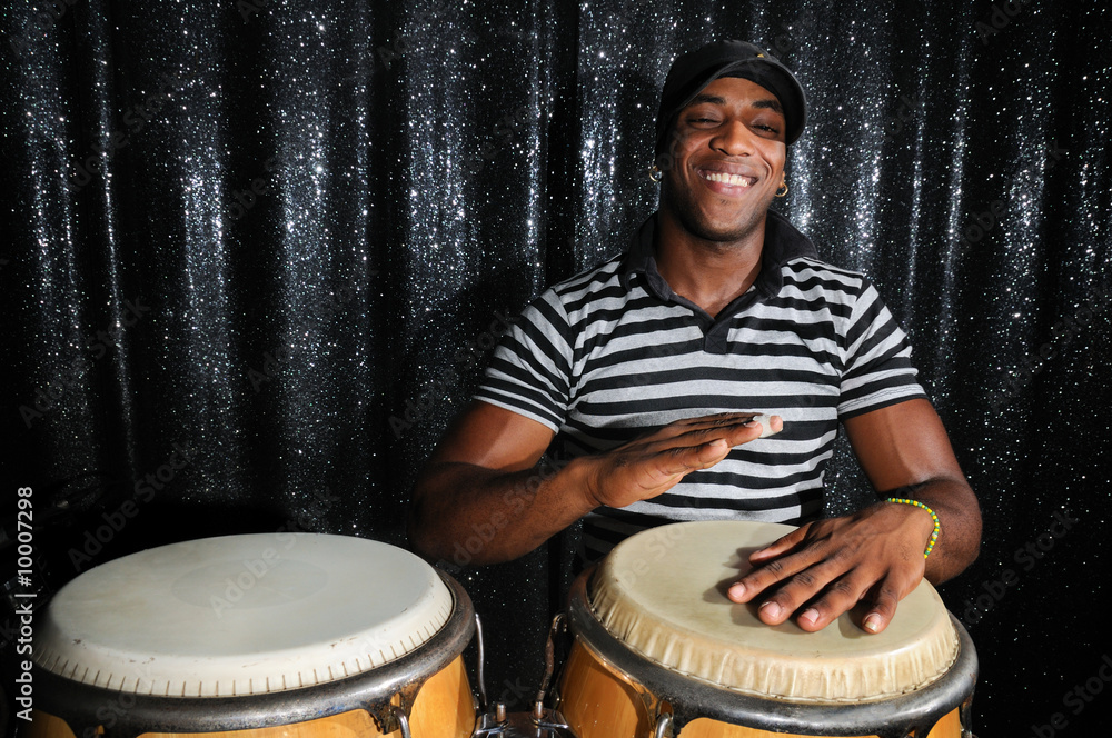 Ταπετσαρία Portrait of young latino percusionist playing african drums