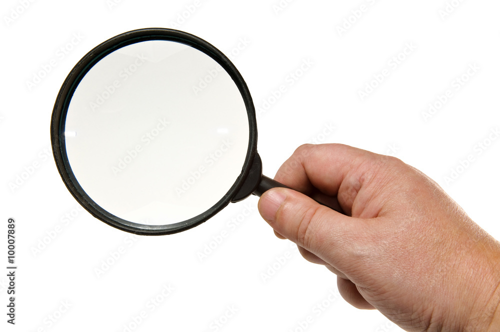 Magnifying glass in hand, isolated on white Magnifying glass in hand, isolated on white