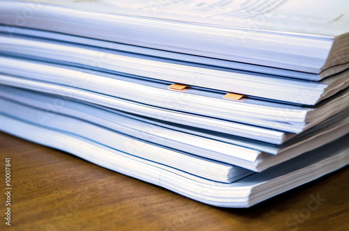 Piles of documents lying on a table photo