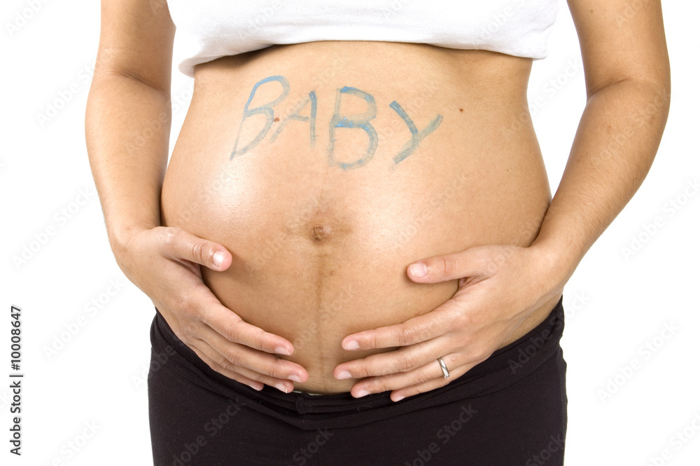 30 weeks pregnant teenager holding her belly with the word baby 30 weeks pregnant teenager holding her belly with the word baby