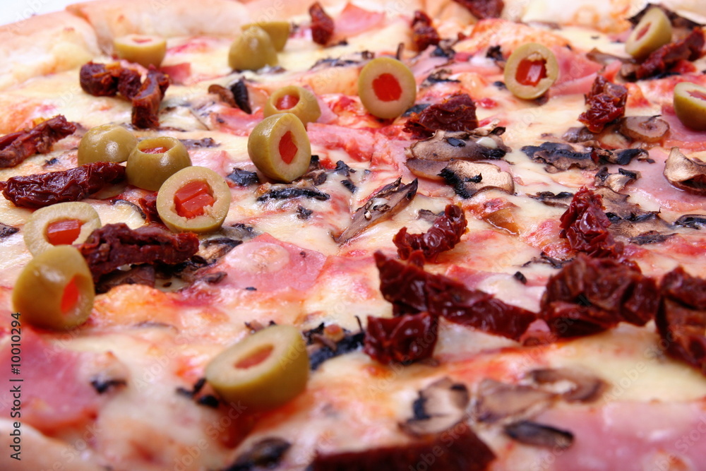 Pizza with bacon,ham, dry tomato and olive Pizza with bacon,ham, dry tomato and olive