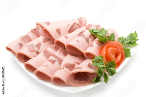 The sausage cut by slices on a dish