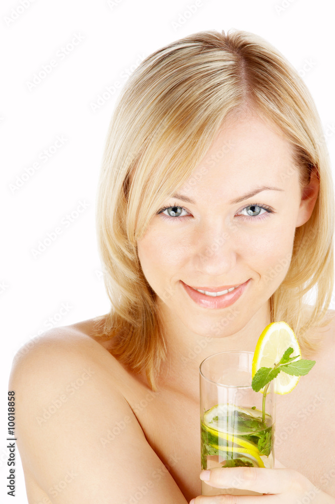 The blonde with a cocktail with mint and a lemon isolated The blonde with a cocktail with mint and a lemon isolated