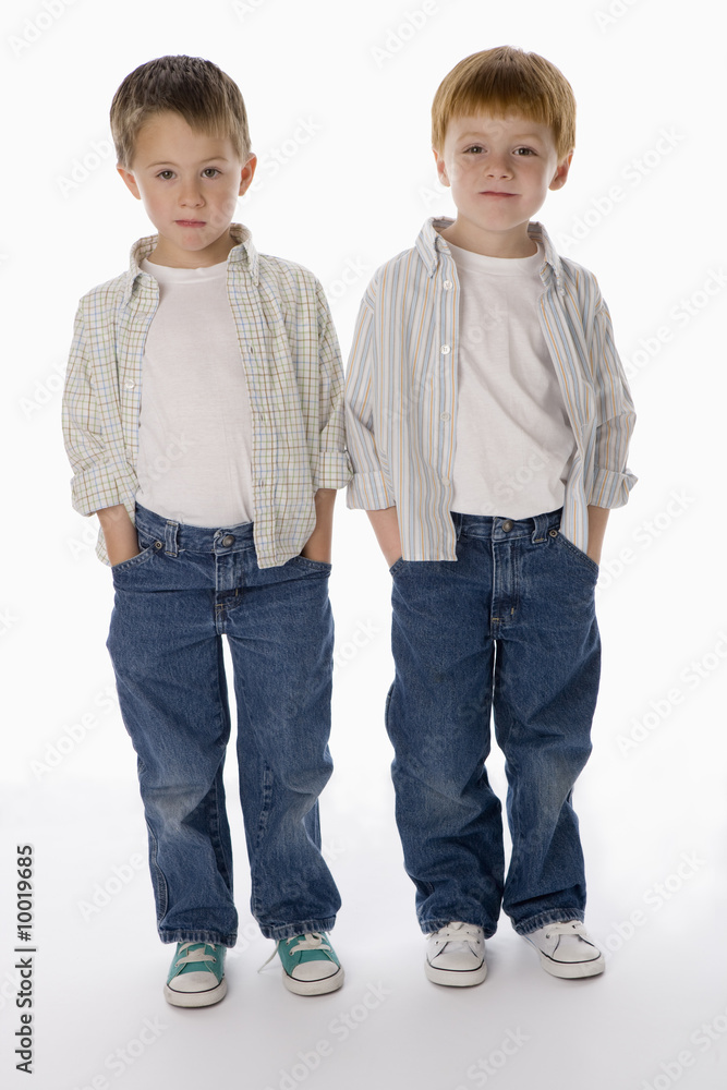Young boys standing together isolated on white background Young boys standing together isolated on white background