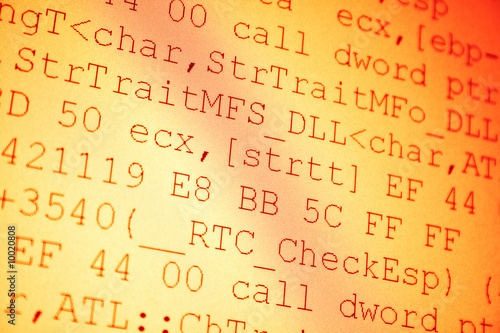 Programming code. Shallow dof red tint.