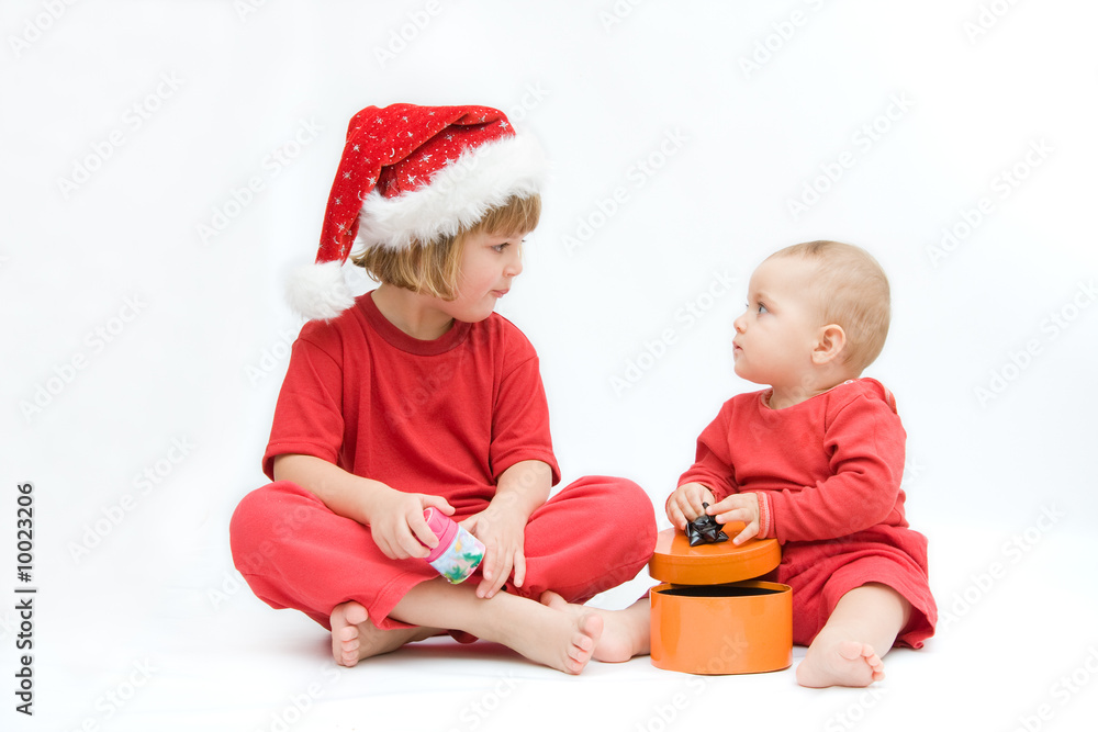 Christmas kids in Santa hat on white background Christmas kids in Santa hat on white background