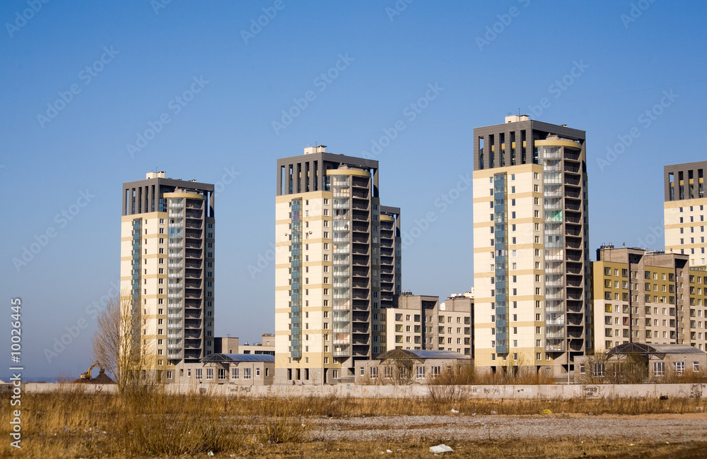 City spring landscape with three identical high houses City spring landscape with three identical high houses