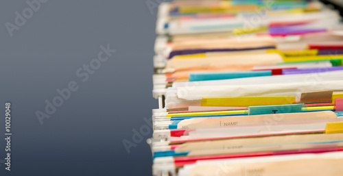 Full hanging file folders showing signs of heavy use