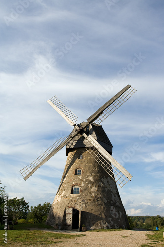 Traditional Old dutch windmill in Latvia against blue sky