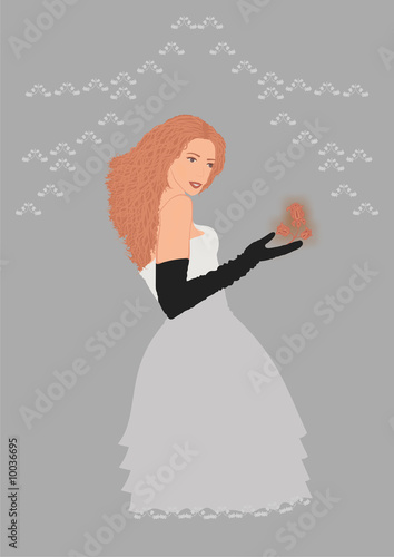 Beautiful lady in evening dress with flower