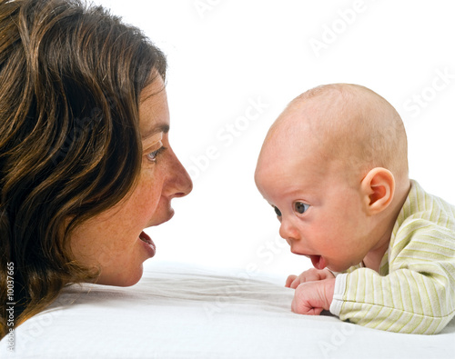 baby on stomach and mother looking at each other