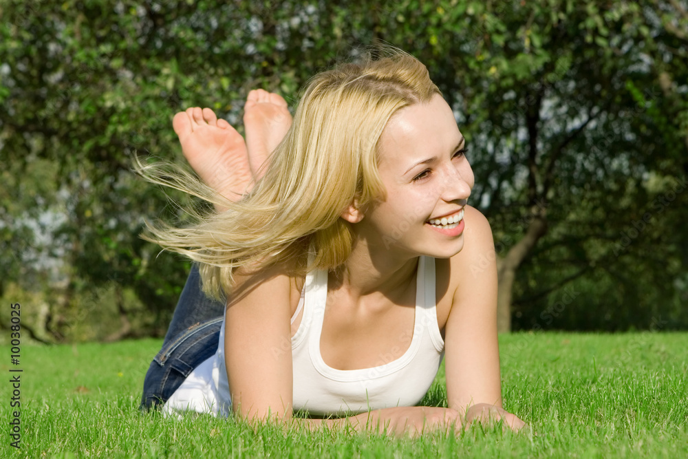 sweet woman rest on the green summer grass sweet woman rest on the green summer grass