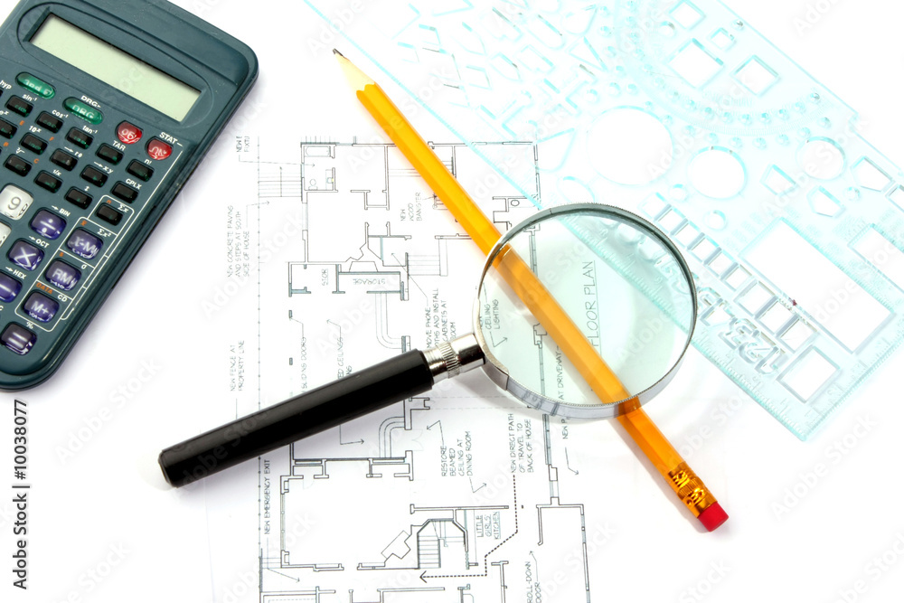 Small magnifier, calculator and pencil on the flat plan Small magnifier, calculator and pencil on the flat plan
