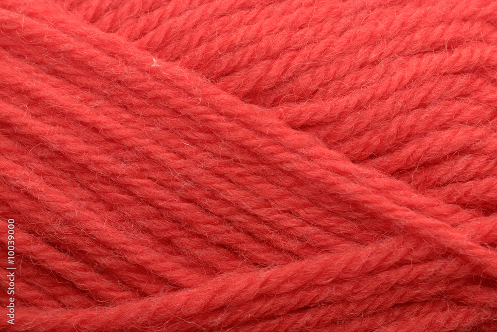 Close-up shot of red yarn, perfect for backgrounds or textures. Close-up shot of red yarn, perfect for backgrounds or textures.