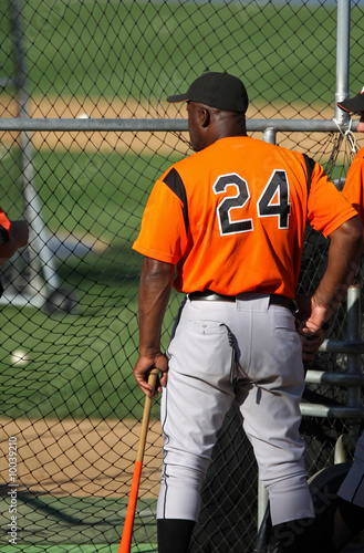 Photography baseball player behind batting cage