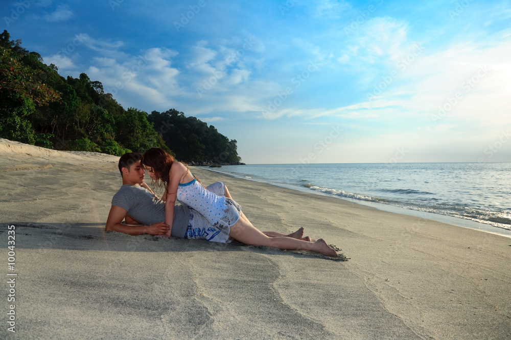 young romantic couple making out on secluded beach Stock Photo Adobe