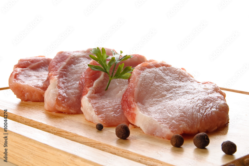 Prepared slices of fresh pork meat with parsley Prepared slices of fresh pork meat with parsley