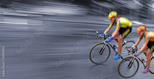 Speedy bicyclists in motion, race, rally, monochrome background,