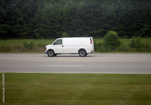 White van speeding down a rural highway © Chris Hart