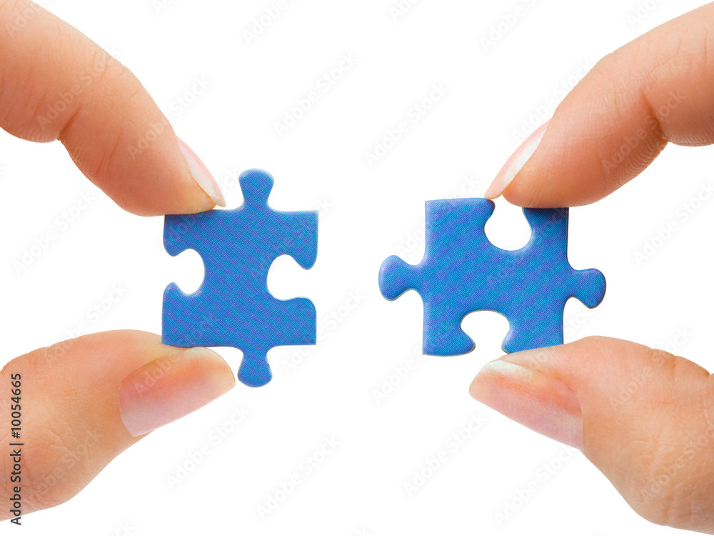 Hands and puzzle isolated on white background Hands and puzzle isolated on white background