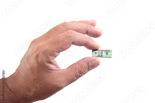 A shrunken twenty dollar bill in hand.