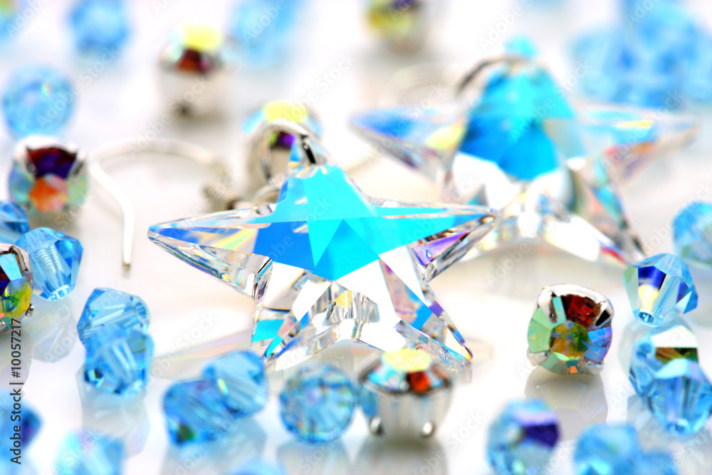 Transparent star shape earrings put together with beads.