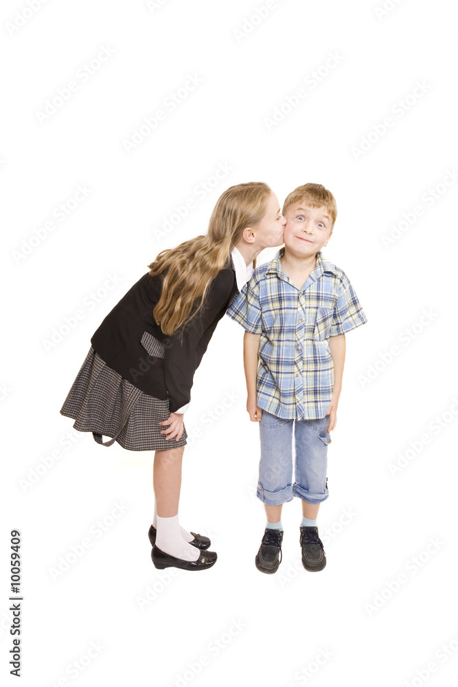 Little girl kissing little boy isolated on white Little girl kissing little boy isolated on white