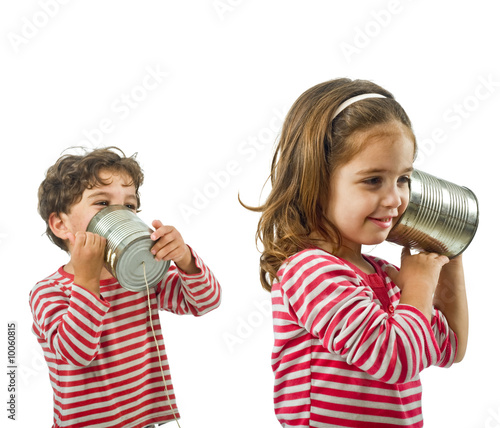 boy and girl talking on a tin phone isolated on white