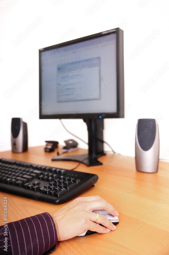 Work with computer - detail. Hand on mouse with monitor Work with computer - detail. Hand on mouse with monitor
