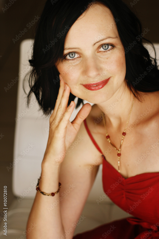 Fototapeta premium Beautiful woman in a red dress