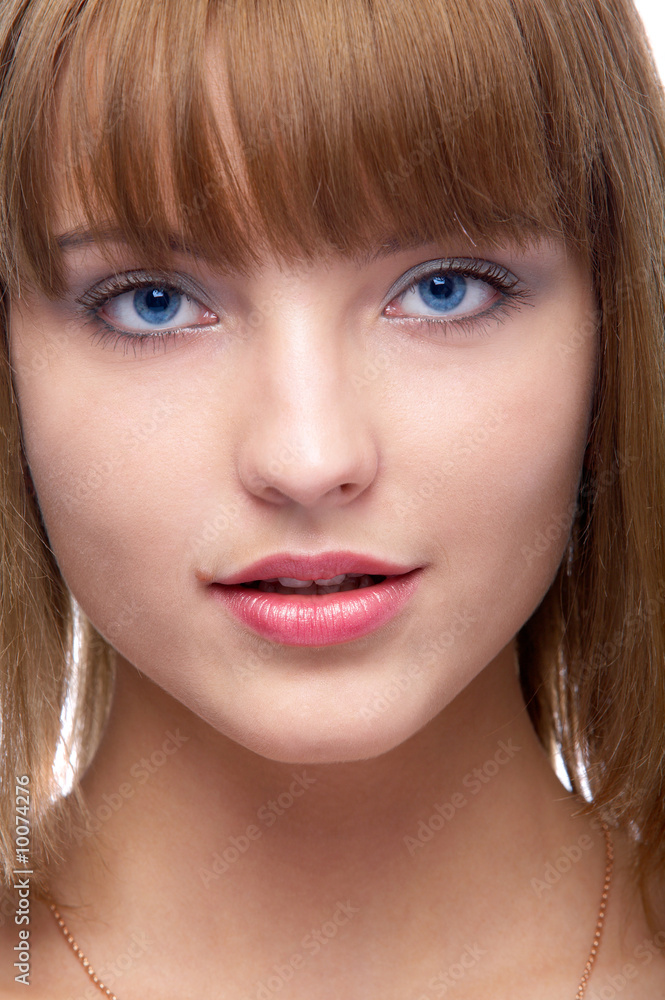 close-up portrait of beautiful blue-eyed woman slightly smiles close-up portrait of beautiful blue-eyed woman slightly smiles