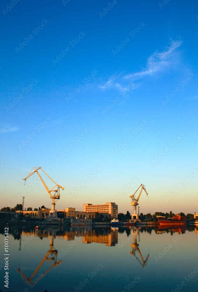 Wide-angle photo of cranes in a shipbuilding plant Wide-angle photo of cranes in a shipbuilding plant
