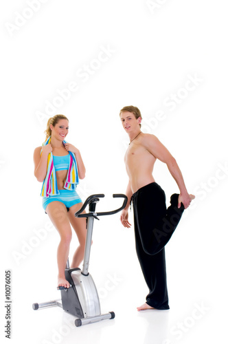 Young couple, female, male doing fitness exercises
