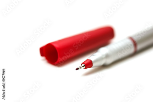 Red pen isolated on white.