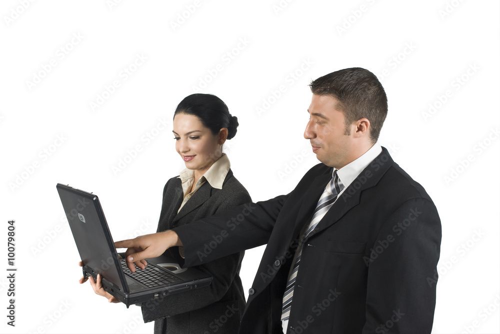Two business people show something on laptop and laugh about... Two business people show something on laptop and laugh about...