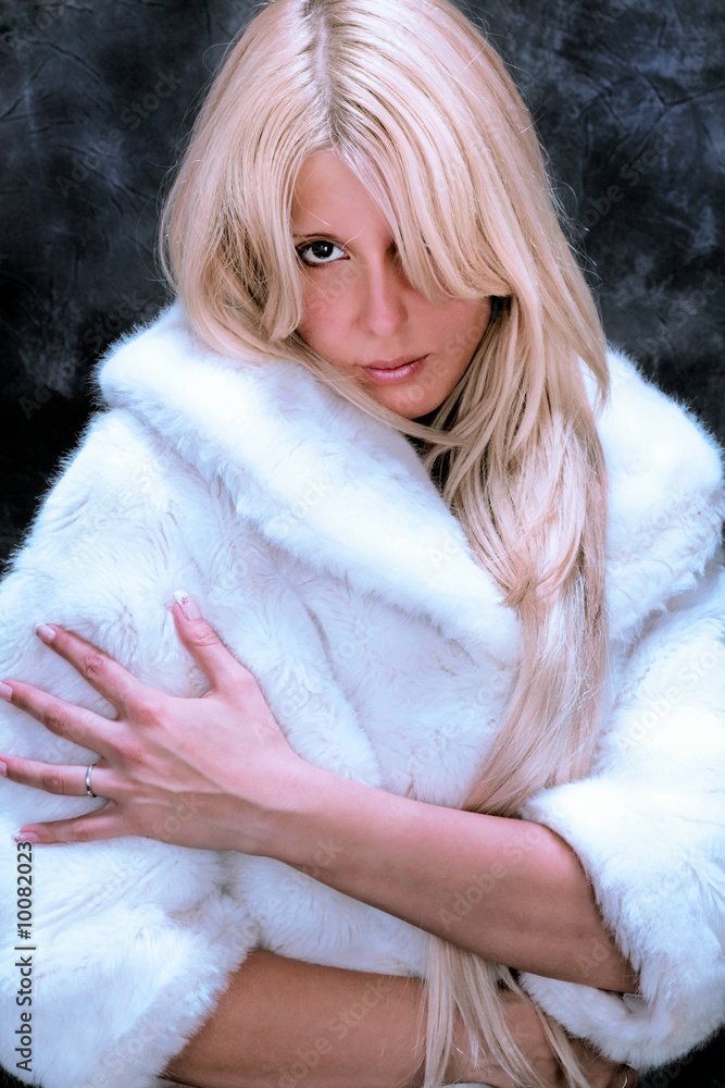 young blond woman in fur