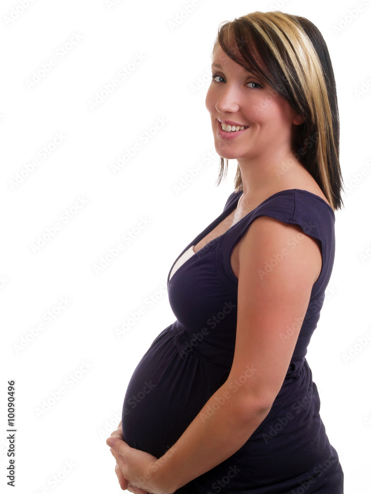 Young pregnant woman in blue dress holding belly Young pregnant woman in blue dress holding belly