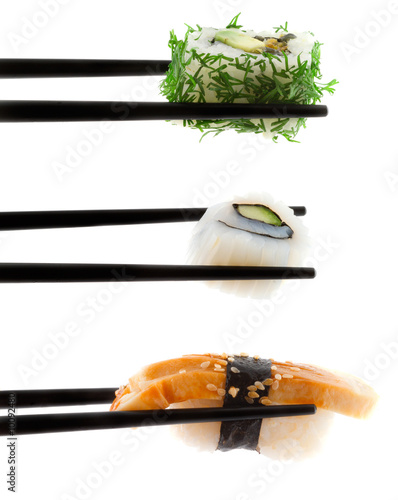 Obraz na płótnie Sushi with chopsticks shot on white. w salonie