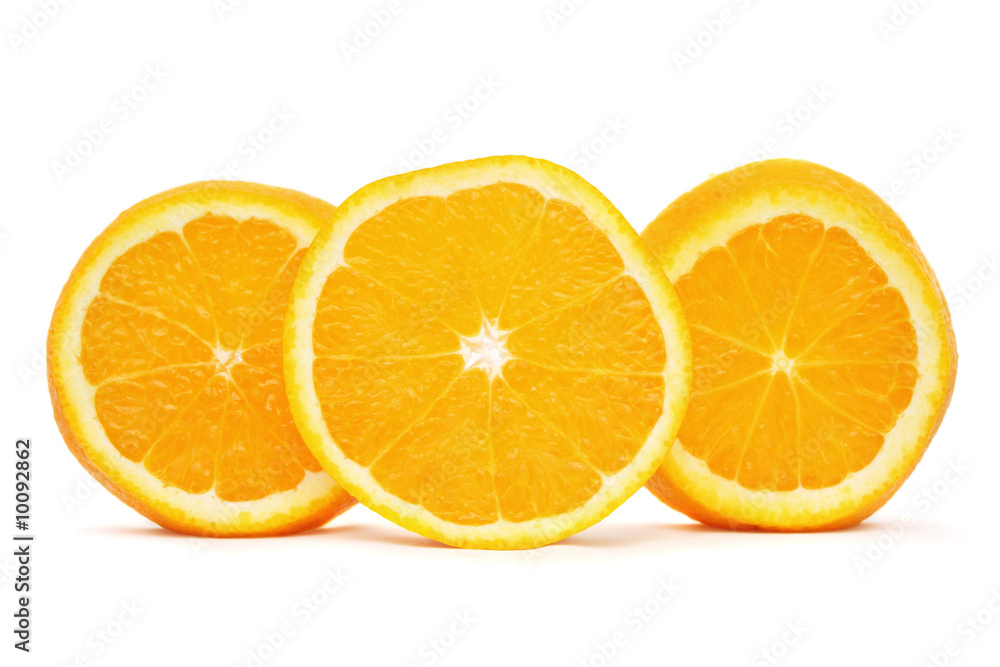 Orange sliced into three pieces standing on white background. Orange sliced into three pieces standing on white background.