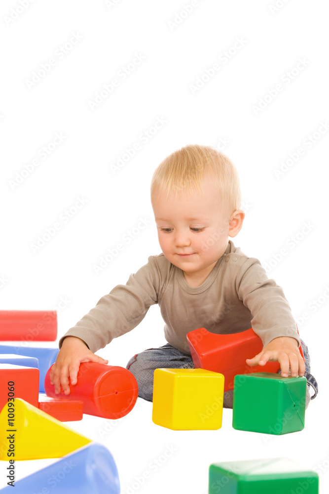 little boy play with bricks. isolated on a white background little boy play with bricks. isolated on a white background